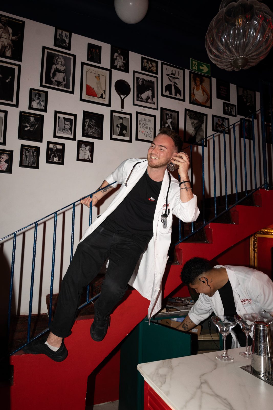Costume-party DJ set on a red staircase at a Casa Très event