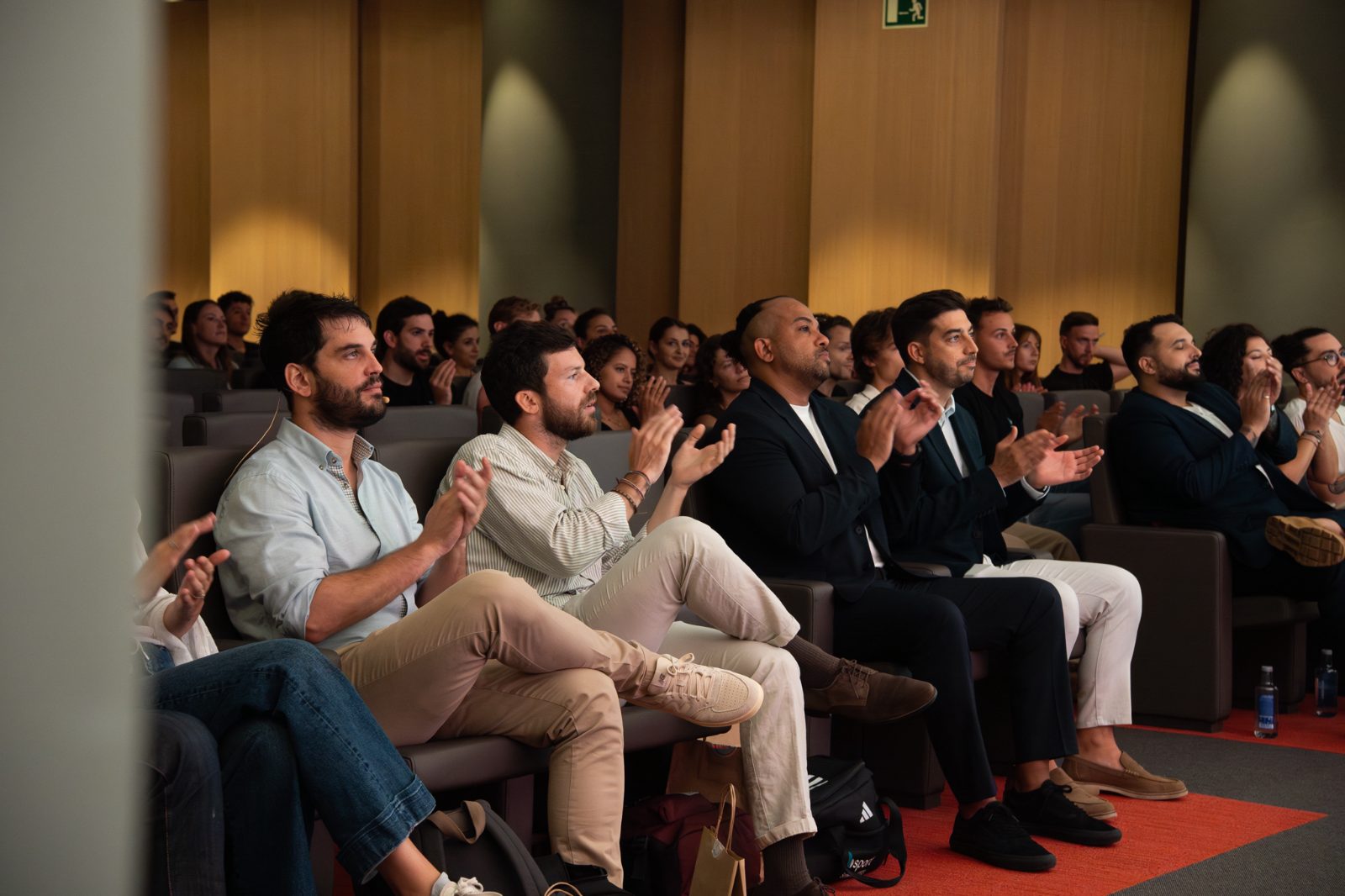 Attendees applauding at a Casa Très corporate sales kick-off in Barcelona