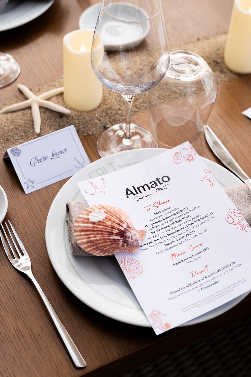 Coastal tablescape with shell place setting and printed menu at the Almato Summer Meet
