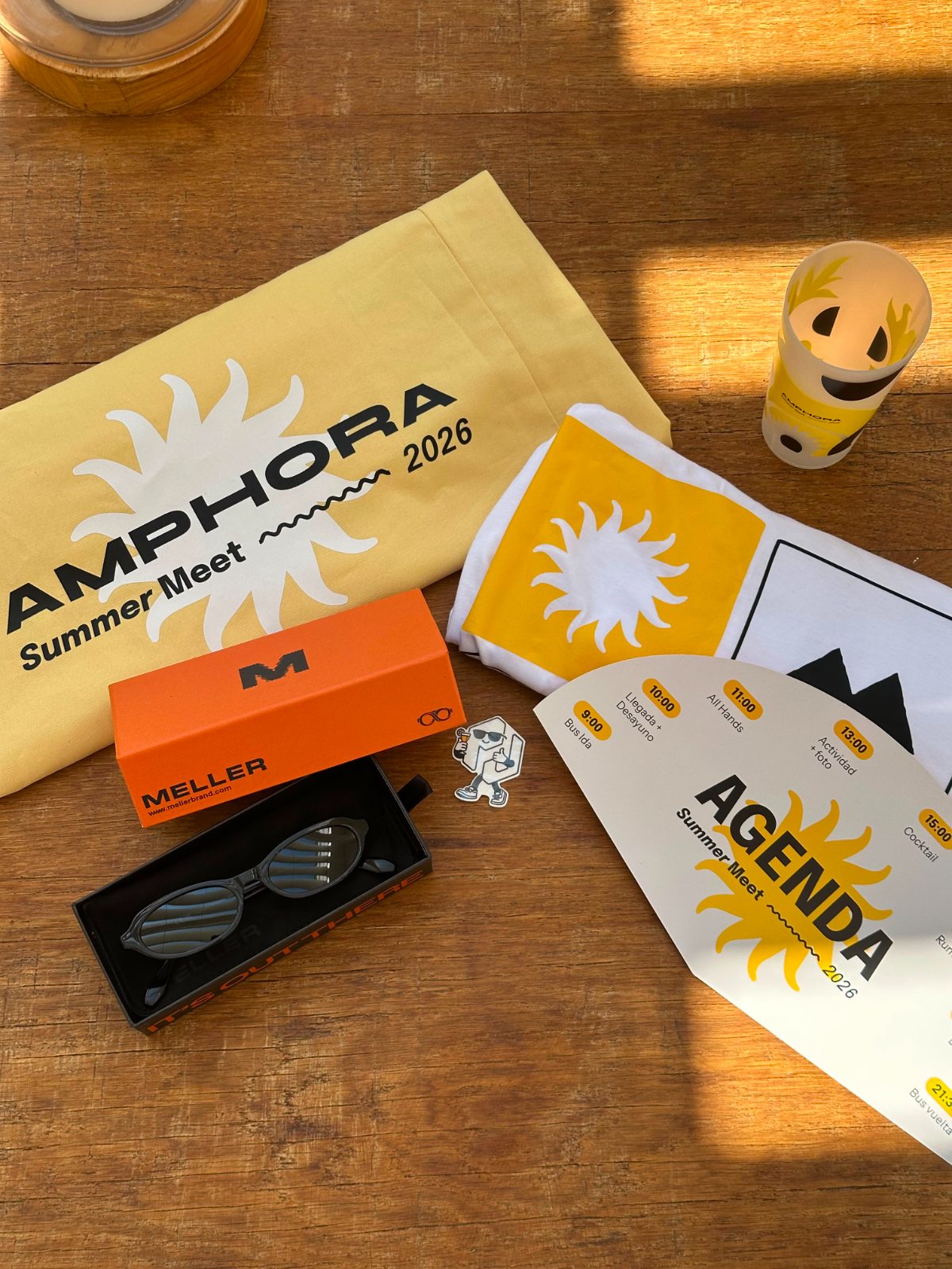 Branded welcome kit with t-shirts, sunglasses and printed agenda for the Amphora Summer Meet